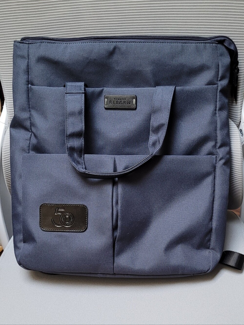 Reborn Navy Blue Laptop Tote - Two Front Pockets Back Pocket, Side Pocket.